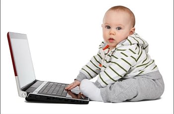 Baby Playing on Laptop Computer
