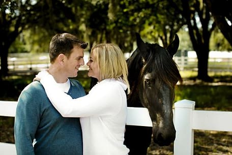 romance-couple-kissing-near-horse