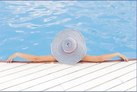 Woman Relaxing by the Pool - Pamper Yourself