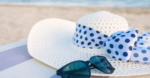 A Hat and Sunglasses on the Beach