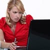 data security woman in red working on laptop