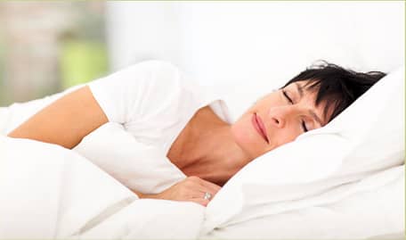 Woman Lying in Bed Sleeping