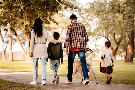 family-walking-in-the-park-during-fall
