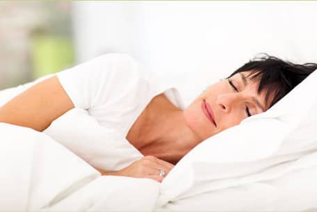Woman Lying in Bed Sleeping