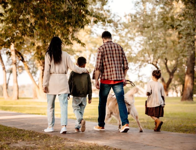 family-walking-in-the-park-during-fall