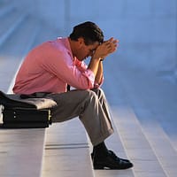 Businessman Thinking on Steps