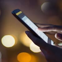 A Woman Using a Smartphone