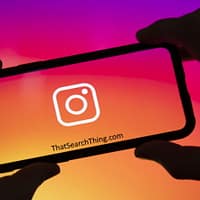 An instagram logo on the screen of a smartphone