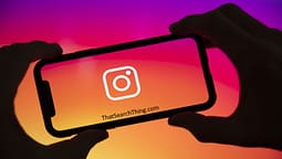 An instagram logo on the screen of a smartphone