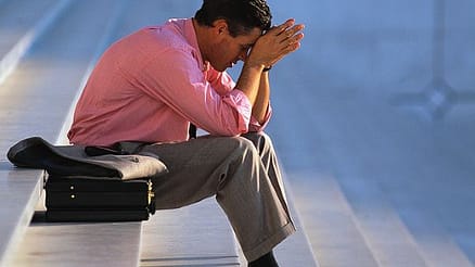 Businessman Thinking on Steps