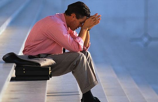 Businessman Thinking on Steps