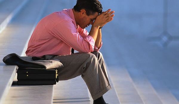 Businessman Thinking on Steps
