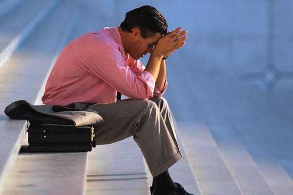Businessman Thinking on Steps