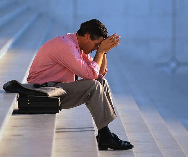 Businessman Thinking on Steps