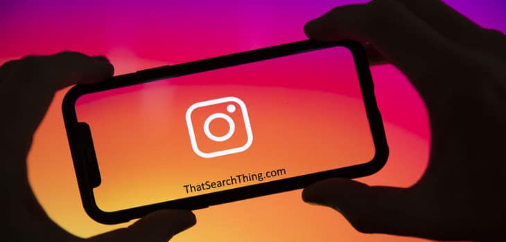 An instagram logo on the screen of a smartphone