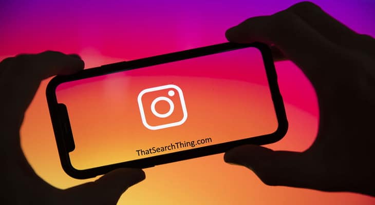 An instagram logo on the screen of a smartphone