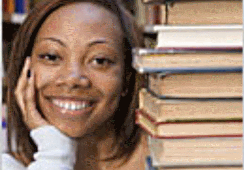 students-smilings-near-books