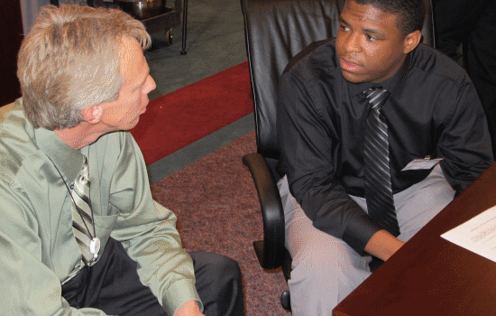 image of student talking to guidance counselor