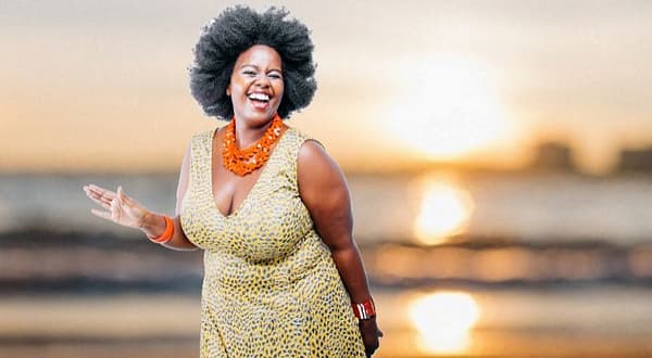 Woman Standing on Warm Sandy Beach