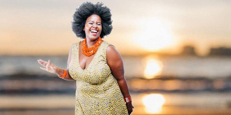 Woman Standing on Warm Sandy Beach