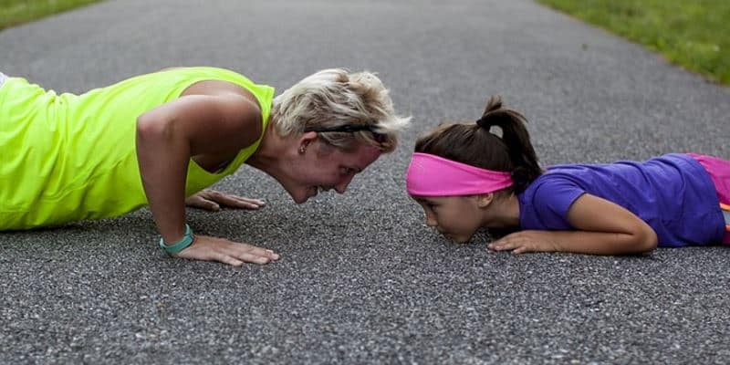 Woman and Child Exercising Regularly