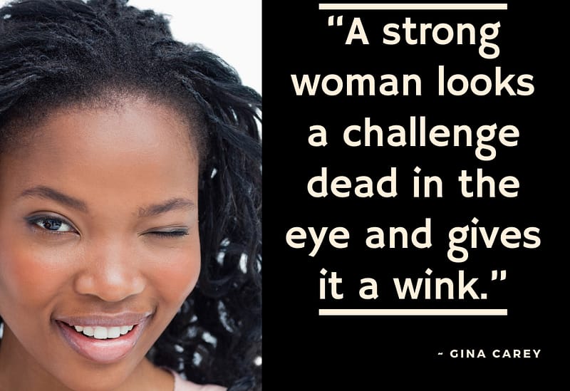 a strong woman winks at a challenge